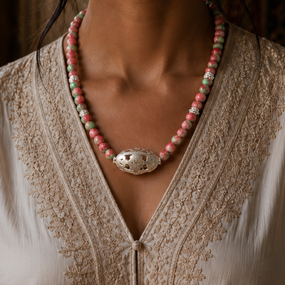 Silver necklace with pink and green stone